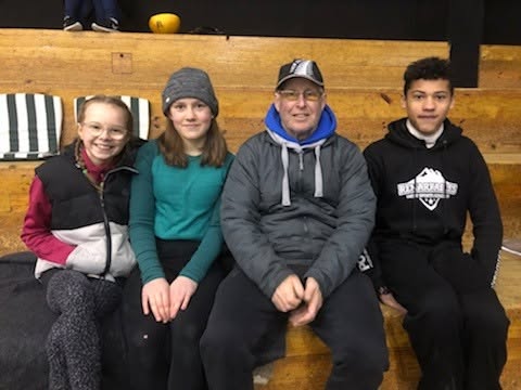Olympic Ice Sports Club members together at the rink